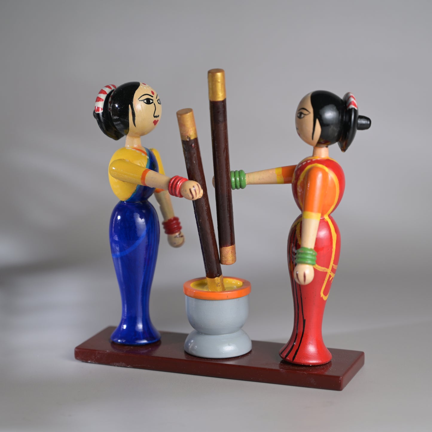 Village scene - Pounding spices